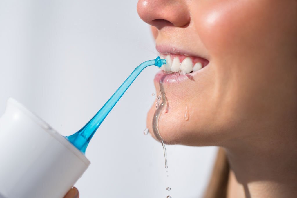 What is an oral irrigator?