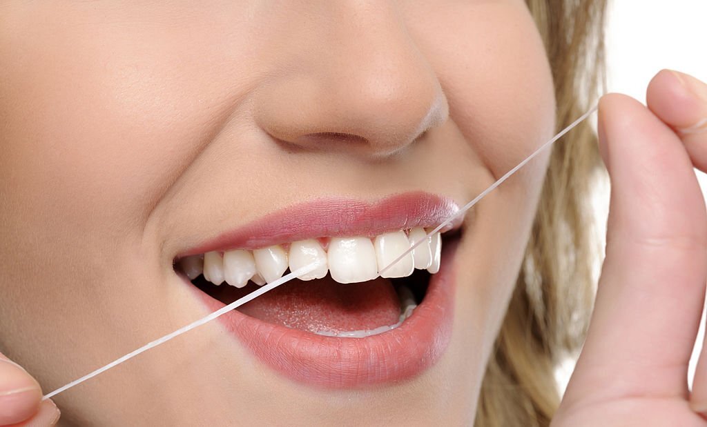 does flossing create gaps in teeth